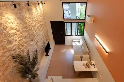 an overhead view of a living room with a couch at AthenianNest Sarri Boutique Studios Psyrri in Athens