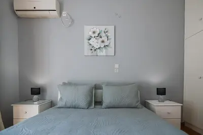 a bedroom with a bed with two night stands at CitySoul Athens in Athens