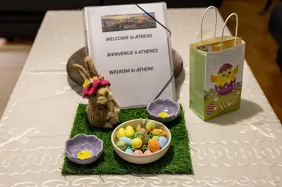 a table with a bowl of easter eggs and a bag at CitySoul Athens in Athens