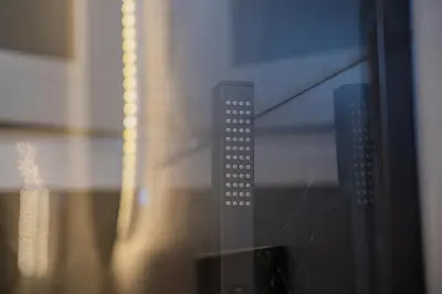 a close up of a microwave doorhandle with a guitar at Athens apartment near city centre in Athens