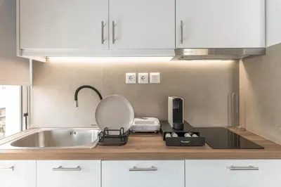 a kitchen counter with a sink and a mixer at South Metro Suite in Athens