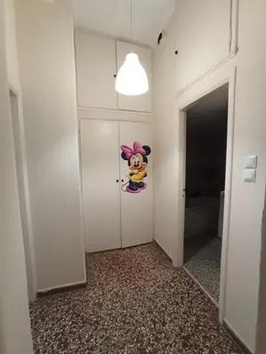 a hallway with a door with a cartoon character on it at Rustic in Athens