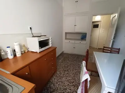 a kitchen with a microwave on top of a counter at Rustic in Athens