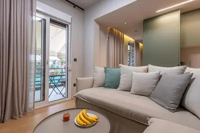 a living room with a couch with bananas on a table at Cozy 1BR with Balcony in Kipseli in Athens