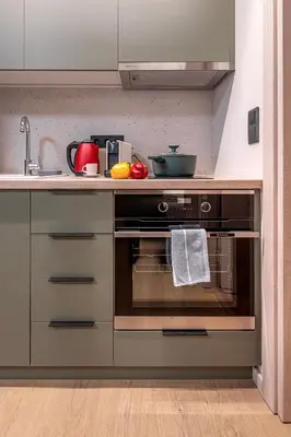 a kitchen with an oven with a sink and a counter at Cozy 1BR with Balcony in Kipseli in Athens