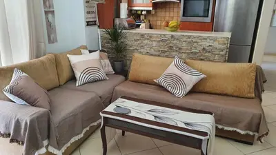 a living room with a couch and a table at Vresthenisden in Athens