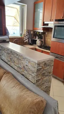 a kitchen with a stone counter top in a kitchen at Vresthenisden in Athens