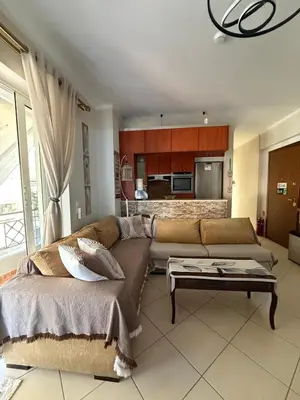 a living room with a couch and a table at Vresthenisden in Athens