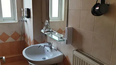a bathroom with a sink and a mirror at Vresthenisden in Athens