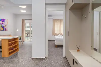 a bathroom with a sink and a desk in a room at Modern & Elegant Getaway near Pasalimani in Piraeus