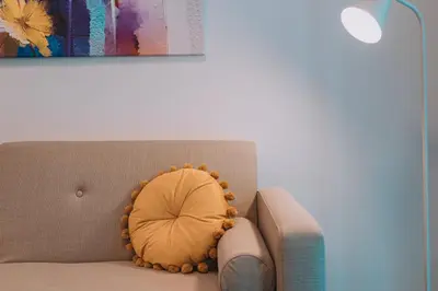 a pillow sitting on a couch in a living room at Modern & Elegant Getaway near Pasalimani in Piraeus