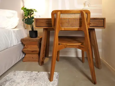 a wooden desk with a chair next to a bed at Graffiti House in Athens