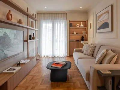 a living room with a couch and a tv at Mixalakopoulou Luxury Apartment in Athens