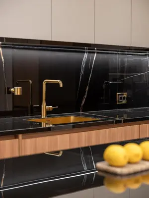 a kitchen with a sink and a counter with some yellowmons at Mixalakopoulou Luxury Apartment in Athens