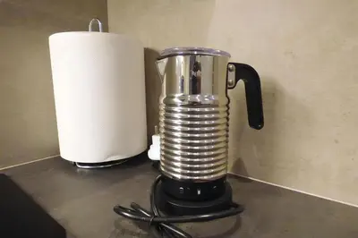 a blender sitting on a counter next to a paper towel at Stylish city studio by MPS in Athens