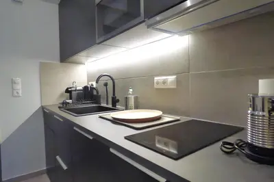 a kitchen with a sink and a counter top at Stylish city studio by MPS in Athens