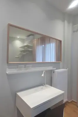 a bathroom with a white sink and a mirror at Stylish city Apartment for 4 by MPS in Athens