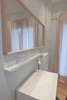 a white bathroom with a mirror and a sink at Stylish city Apartment for 4 by MPS in Athens