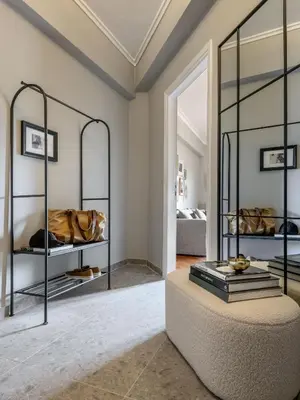 a room with a large ottoman and a mirror at The Apartment 09 in Athens