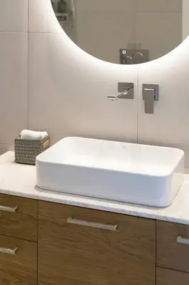 a bathroom with a white sink and a mirror at The HostMaster WiseView Acropolis in Athens