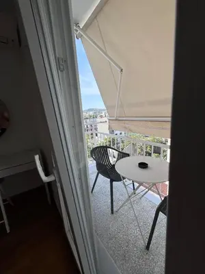 a view of a balcony with a table and chairs at Krezias Apartments ST 6 Acropolis View in Athens