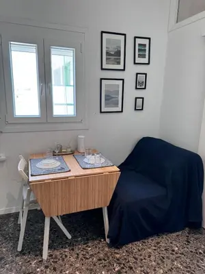 a bedroom with a desk and a bed and a table at Krezias Apartments ST 6 Acropolis View in Athens