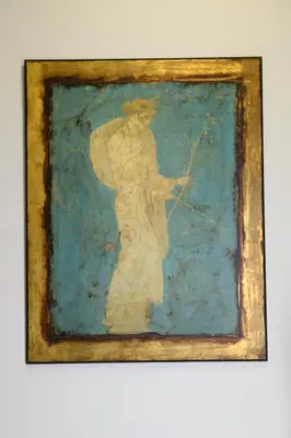 a painting of a woman with a bow and arrow at Art Squared in Athens