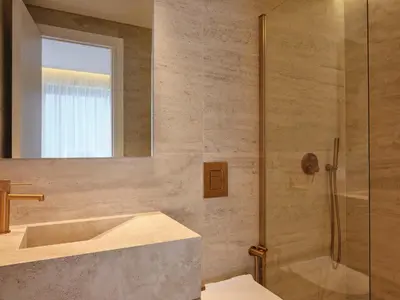 a bathroom with a sink and a shower at Nur City Suites in Athens
