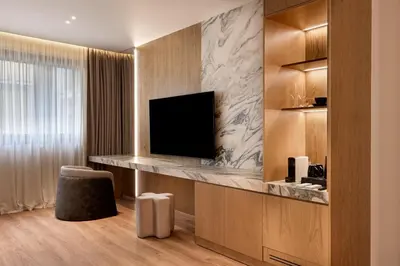 a room with a flat screen tv in a room at Nur City Suites in Athens