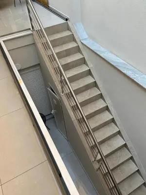 a staircase in a building with a stair case at Electra's apartments in Piraeus