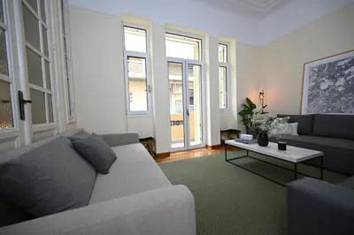 a living room with a couch and a table at The Ilisian Estia in Athens