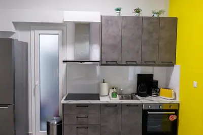 a kitchen with a sink and a counter top at Apartment in Athens Victoria sguare in Athens