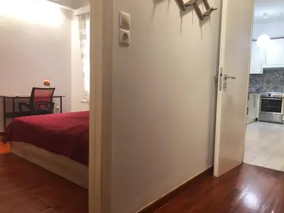 a room with a door leading to a bedroom at Cozy flat in the heart of Athens in Athens