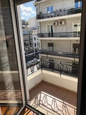 a balcony with a view of a building at Cozy flat in the heart of Athens in Athens
