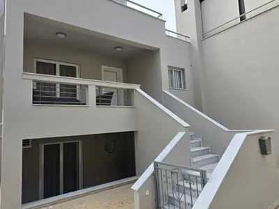 a view of the stairs of a building at Alme Sélas in Port Rafti in Porto Rafti