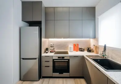 a kitchen with a refrigerator and a sink at Alme Sélas in Port Rafti in Porto Rafti