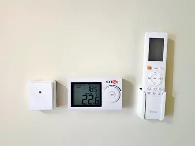 an electronic clock on a wall with a timer at Elaine's Athens Riviera Studios in Athens