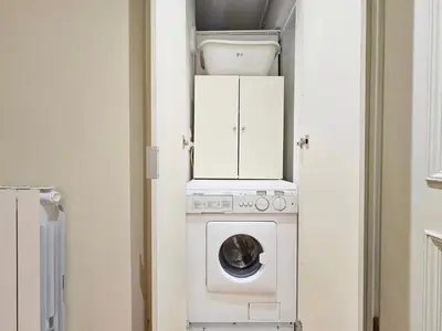 a laundry room with a washer and dryer at Elaine's Athens Riviera Studios in Athens