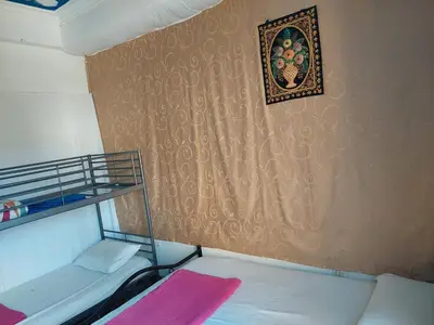 a bedroom with a bunk bed and a picture on the wall at SHARED ROOMS NEAR ACROPOLIS & MONASTIRAKi area in Athens