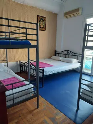 a room with two bunk beds and a blue floor at SHARED ROOMS NEAR ACROPOLIS & MONASTIRAKi area in Athens