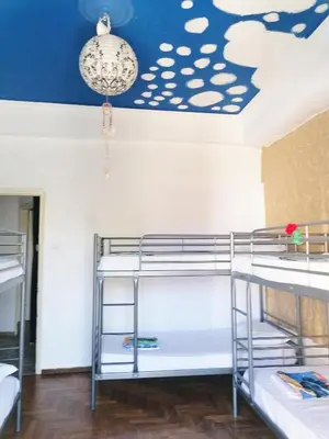 a room with bunk beds and a blue ceiling at SHARED ROOMS NEAR ACROPOLIS & MONASTIRAKi area in Athens