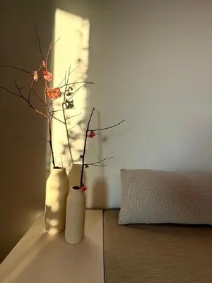 a room with two vases with flowers in it at Sunny Downtown Glyfada Penthouse in Athens