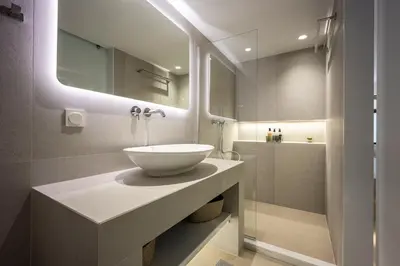 a bathroom with a bowl sink and a shower at Downtown Properties Loft 2 in Athens