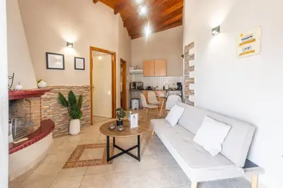 a living room with a couch and a table at Fantasea Porto Rafti on the sea 15 minutes from the airport in Porto Rafti