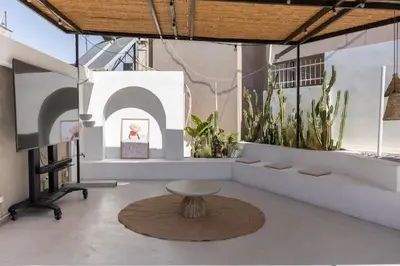 a room with a table and some plants at The Rooftop in Athens