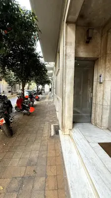 a building with motorcycles parked outside of a building at Freddy enjoy kolonaki in Athens