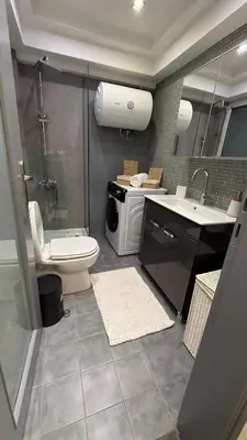 a bathroom with a toilet and a sink and a shower at Freddy enjoy kolonaki in Athens