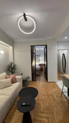 a living room with a couch and a table at Acropolis luxury home by Cleo in Athens