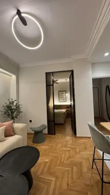 a living room with a couch and a table at Acropolis luxury home by Cleo in Athens