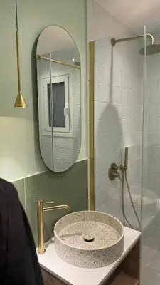 a bathroom with a sink and a mirror at Acropolis luxury home by Cleo in Athens